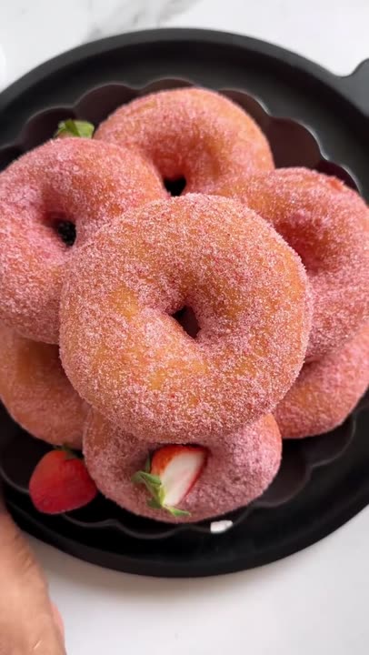 Strawberry Doughnuts You’ll need: • 4 cups bread flour (525 g) • 1¼ cups warm milk (300 ml) • ¼ cup sugar (50 g) • 2¼ tsp instant yeast (7 g) • 1 medium egg (50 g) • ½ stick butter, softened (60 g) • ½ tsp salt (4 g) • 1 tsp strawberry extract • Oil for frying For the strawberry sugar: • 1 cup granulated sugar (200 g) • ½ cup freeze dried strawberries (15 to 20 g) #strawberrydoughnuts #doughnuts #donuts
